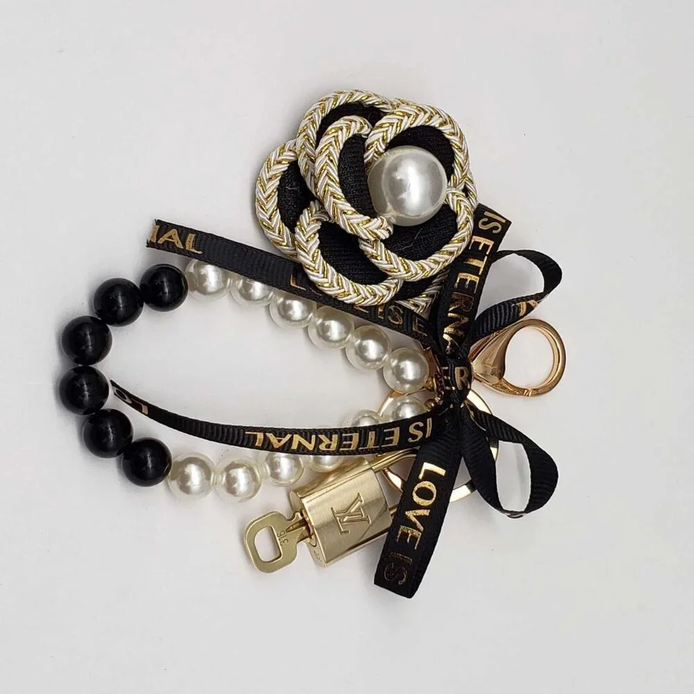 Authentic Louis Vuitton Lock & Key with unbranded flower Bagcharm, Keycharm